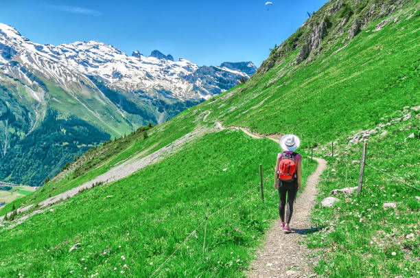 istock Swiss Alps. A man in a white hat 927581788