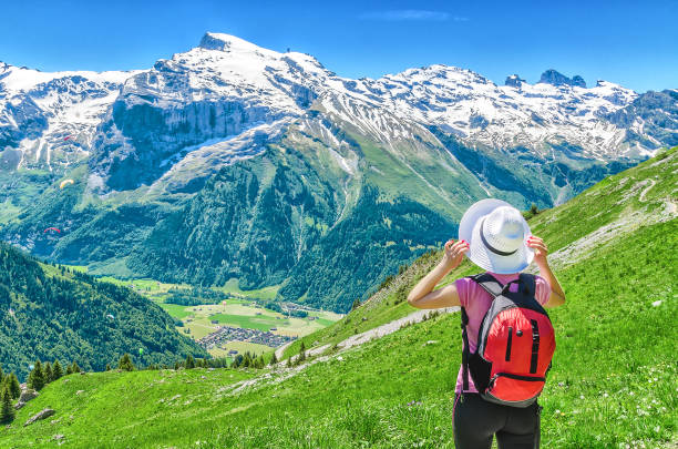 istock Swiss Alps. Girl in a white hat 927581966