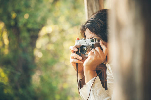 Woman and retro camera  in nature