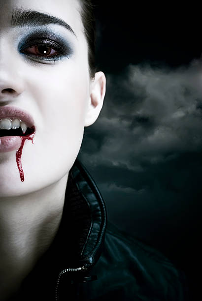 Vampire Portrait of a female vampire. Halloween theme. See more vampires (XXXL size) in my lightbox "Spooky  vampire woman stock pictures, royalty-free photos & images