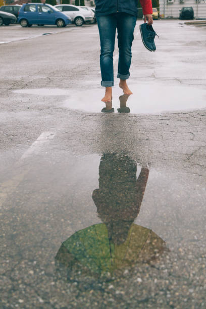 istock Woman walk on the rain 927592124