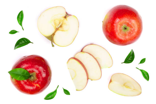 istock red apples with slices and leaves isolated on white background top view. Set or collection. Flat lay pattern 927592256