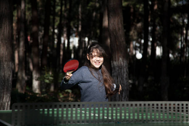 istock girl playing table tennis 927598966