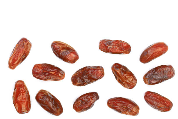 istock dry dates isolated on white background with copy space for your text. Top view. Flat lay pattern 927599168