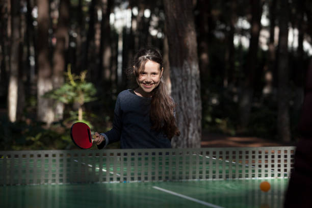 istock girl playing table tennis 927599432
