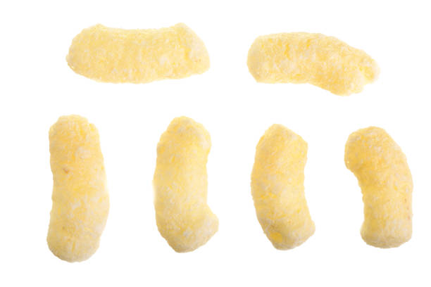 istock Sweet crunchy corn sticks or snacks isolated on white background. Top view. Flat lay 927599644