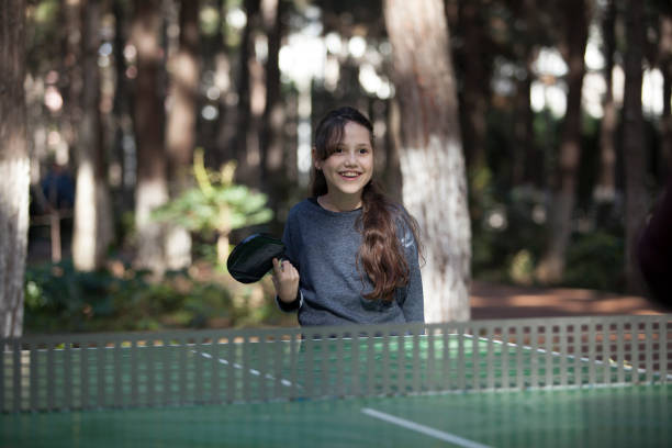 istock girl playing table tennis 927600378