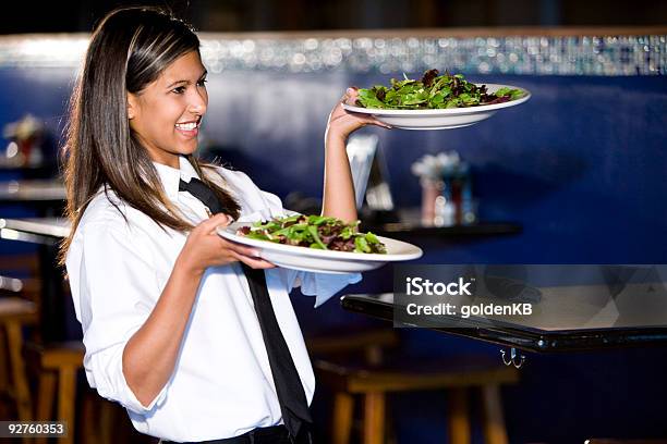 Happy Hispanic Waitress Serving Salads Stock Photo - Download Image Now - Plate, Waitress, 20-24 Years