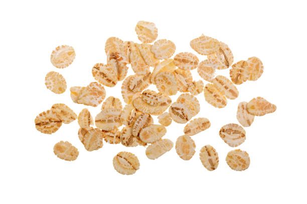istock oat flakes isolated on white background. Top view 927603568