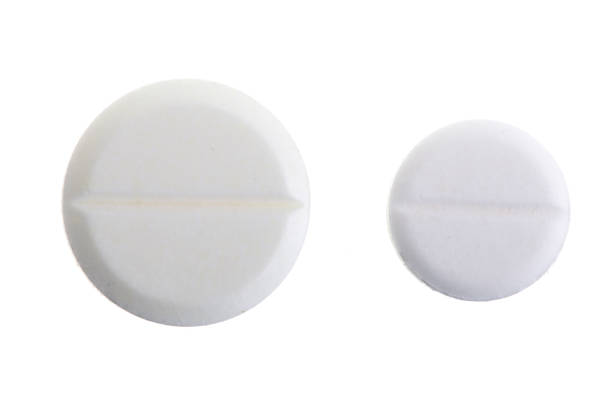 istock white pill capsule isolated on white background macro. Top view 927607204