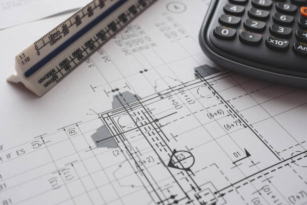 istock Detail view of architectural and structural construction drawings with designer tools. 927617006