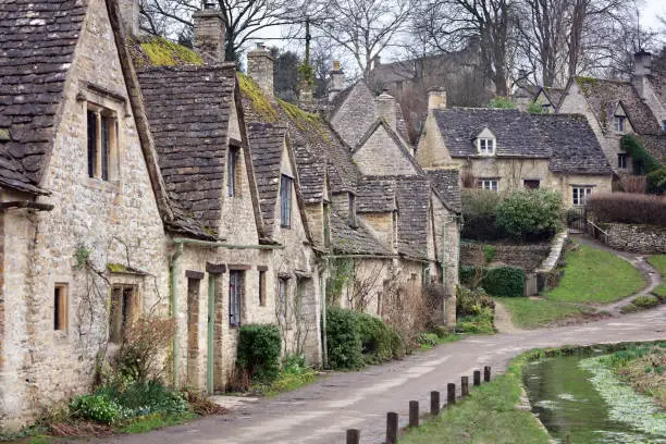 Houses of Arlington Row in the Cotswold village of Bibury, Gloucestershire, England