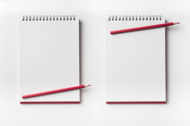 istock Top view of red spiral notebook and color pencil collection 927623652