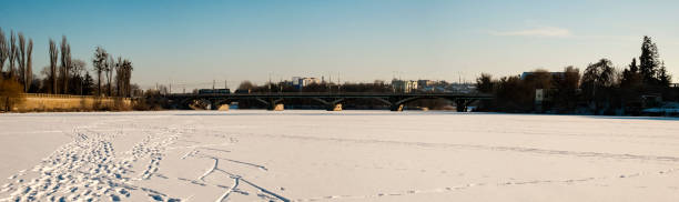 Central bridge over the Southern Bug River in winter (Ukraine, Vinnitsa) Central bridge over the Southern Bug River in winter (Ukraine, Vinnitsa) vinnytsia photos stock pictures, royalty-free photos & images