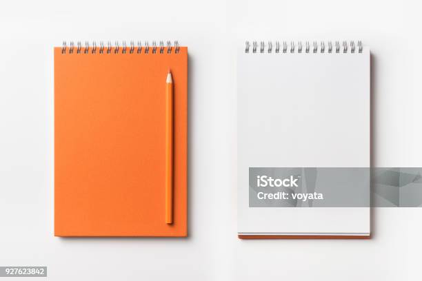 Top View Of Orange Spiral Notebook And Color Pencil Collection Stock Photo - Download Image Now