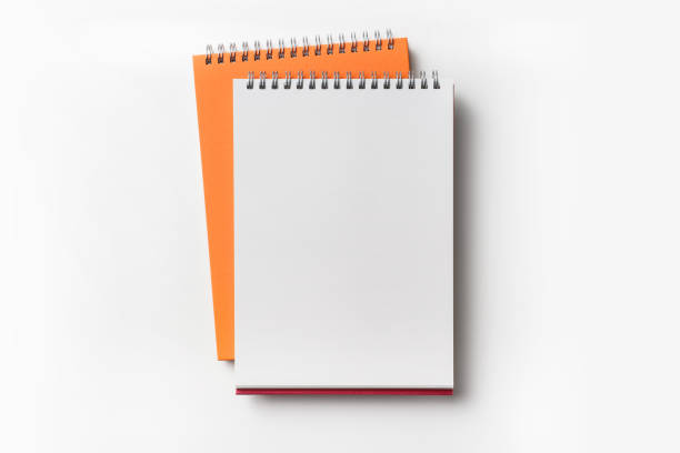istock Top view of orange spiral notebook 927625964