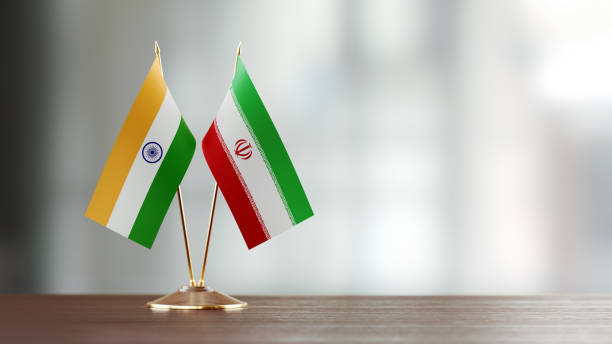 istock Indian And Iranian Flag Pair On A Desk Over Defocused Background 927626164