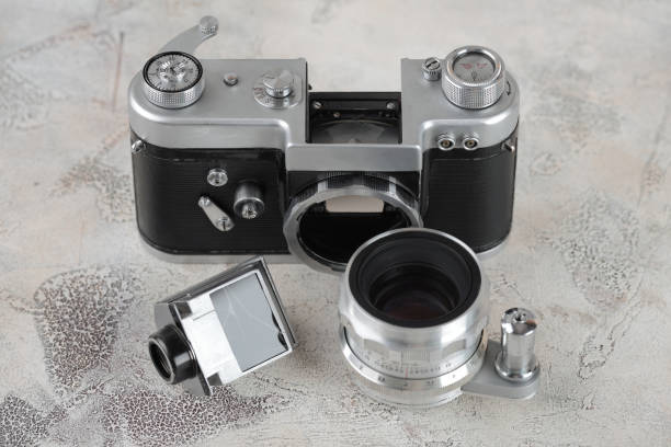 istock The old 35 mm SLR film camera on cement background. 927627128