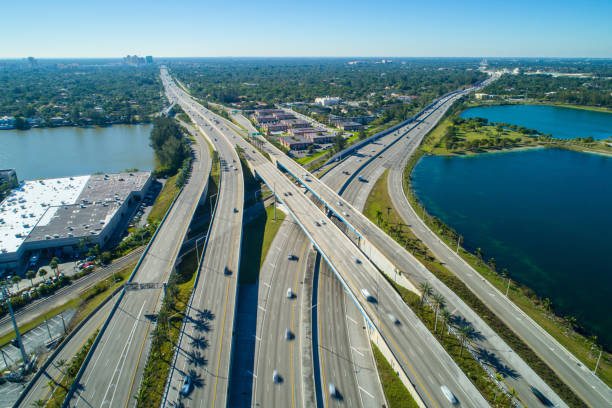 istock Cars driving on a highway interchange long exposure motion blur 927632936