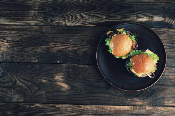istock Two tasty fresh meat burgers on plate. 927638320