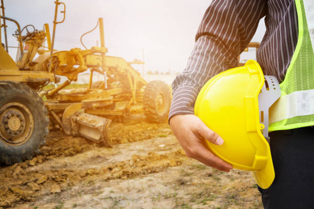 istock Asian business man construction engineer worker with yellow protective helmet at construction site 927641140