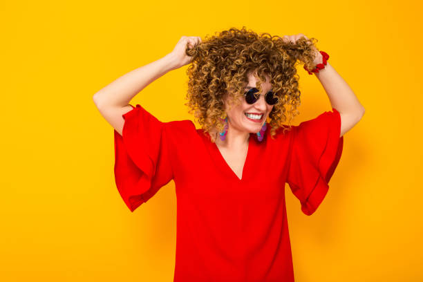 istock Attractive woman with short curly hair 927643900