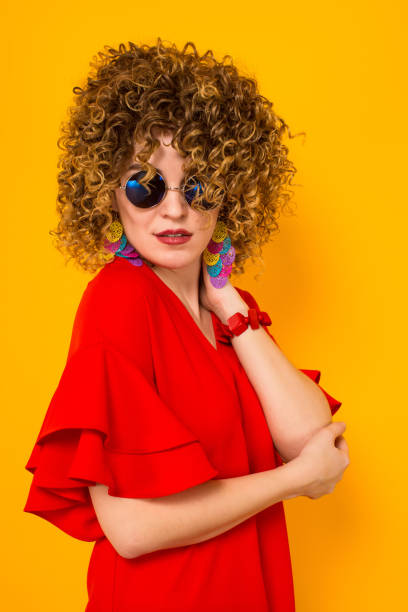 istock Attractive woman with short curly hair 927644480
