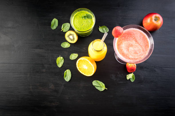 istock selection of fresh juice on dark table 927650002