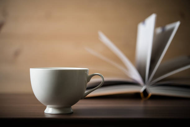 istock Books with coffee on wooden background 927653184