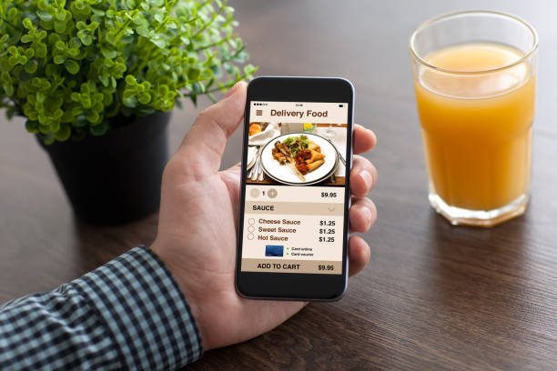 istock man hand holding phone with app delivery food on screen 927659810