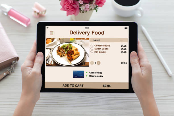 istock woman hands holding tablet computer with app delivery food screen 927661116