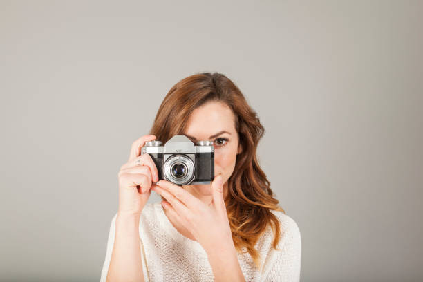 istock brunette female photographer portrait 927670446