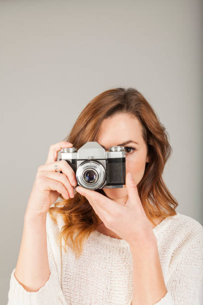 istock female photographer studio portrait 927670458