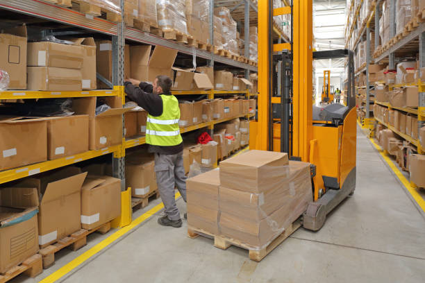 Order Picking Worker Order Picking in Fulfillment Warehouse forklift photos stock pictures, royalty-free photos & images