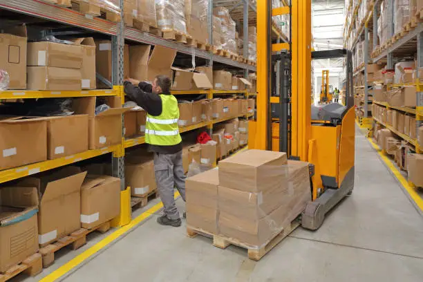 Worker Order Picking in Fulfillment Warehouse