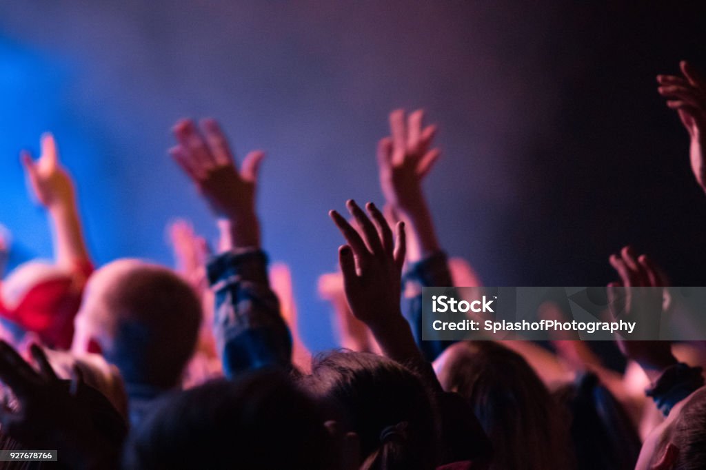 Worship hands raised People raising their hands in worship Praising - Religion Stock Photo