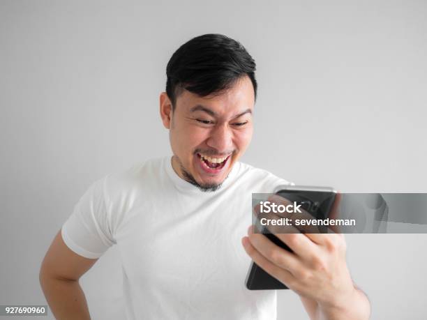 Funny Laugh Face Of Man Watching Funny Video Clip Share In Social In The  Smartphone Stock Photo - Download Image Now - iStock