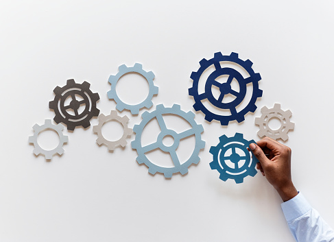 Hand with support gears isolated on white background