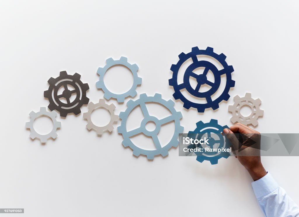 Hand with support gears isolated on white background Order Stock Photo