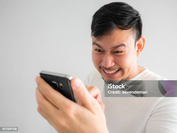 Funny Laugh Face Of Man Watching Funny Video Clip Share In Social In The Smartphone Stock Photo - Download Image Now - iStock Funny Laugh Face Of Man Watching Funny Video Clip Share In Social In The Smartphone Stock Photo - Download Image Now - iStock