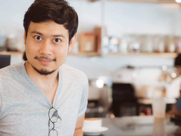 istock Man is drinking hot coffee in the coffee cafe. 927691140