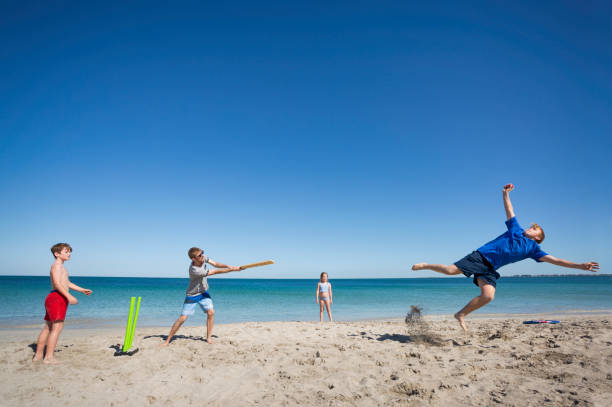 Playing beach cricket, an Australian family tradition.