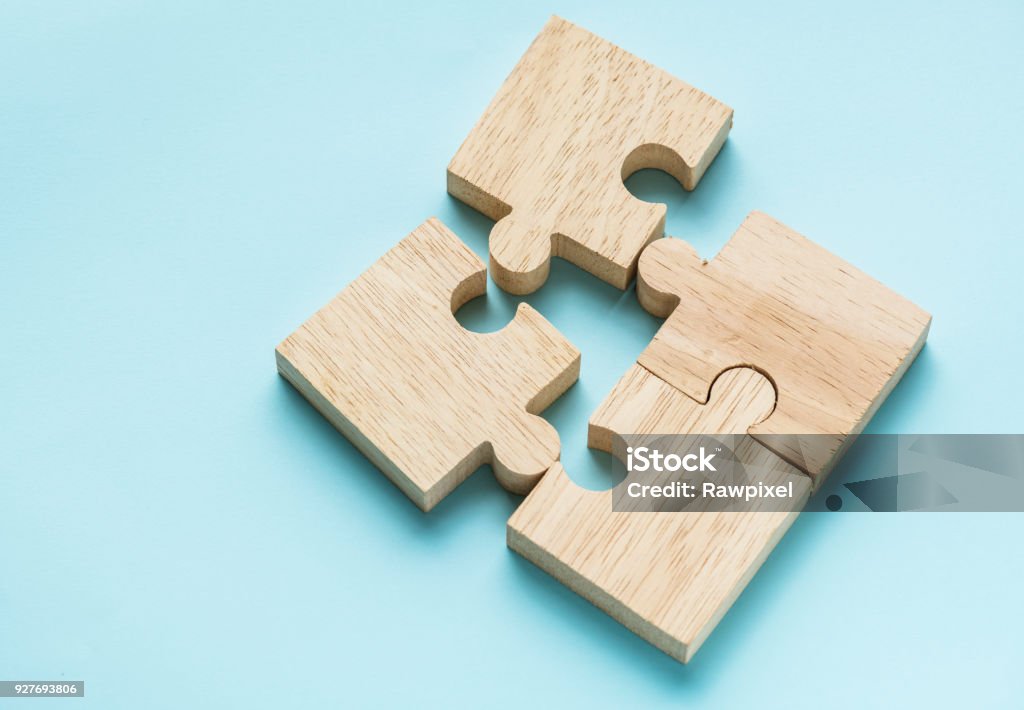 Jigsaw teamwork concept macro shot Puzzle Stock Photo