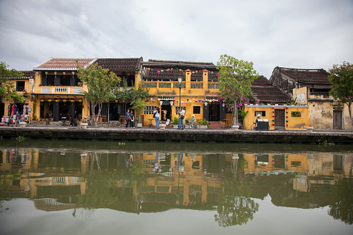 On August 26, 2016, travel destination town of Hoi An in Vietnam is reflected on the waters of Thu Bon River.