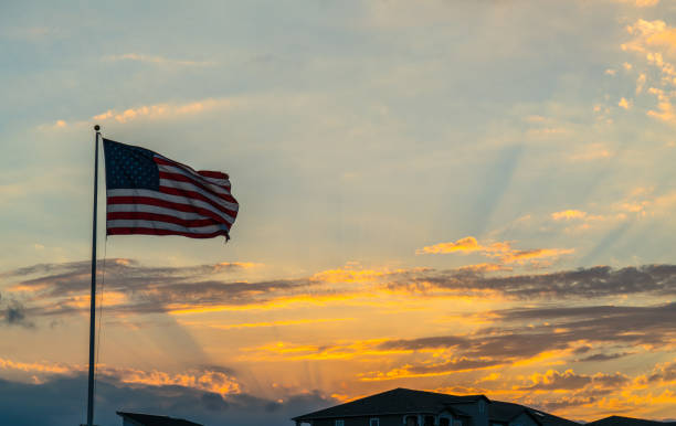 Perfect American Flag waving right after a perfect sunset