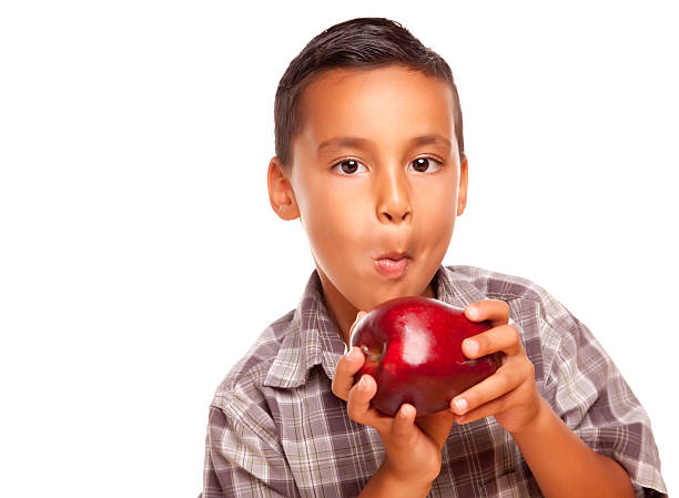 istock Adorable Hispanic Boy Eating A Big Red Apple 92771293