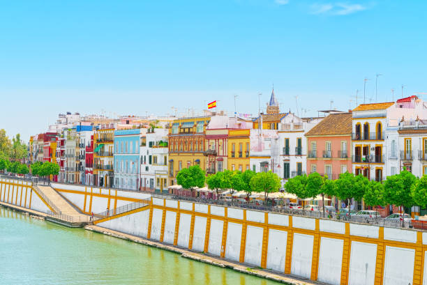 View from the coast of the Guadalquivir to the Triana district in Seville. Spain. Seville, Spain - June 08, 2017 : View from the coast of the Guadalquivir to the Triana district in Seville. Spain. seville port stock pictures, royalty-free photos & images