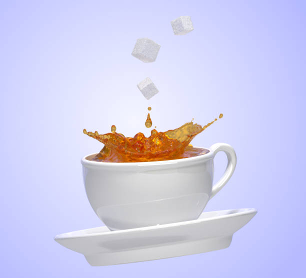 istock splash of tea and sugar cubes with white cup 3D illustration on blue background,isolated 927720982