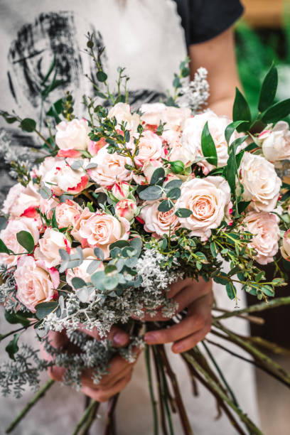 istock Florist making beautiful bouquet 927724258