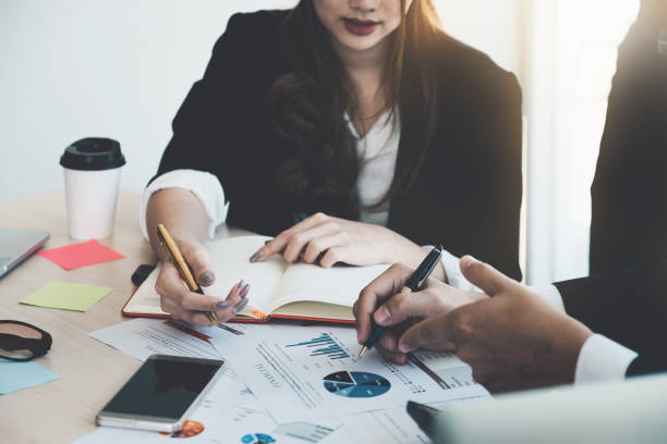 istock Close up image of Business People Analyzing Statistics Business Documents, Financial Concept 927724448